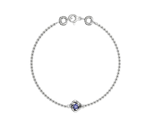 Gemmes De La Divinite bracelet, platina, set with a brilliant-cut blue sapphire. Thickness: 1.8 mm. Diameter of the pattern: 8.5 mm.