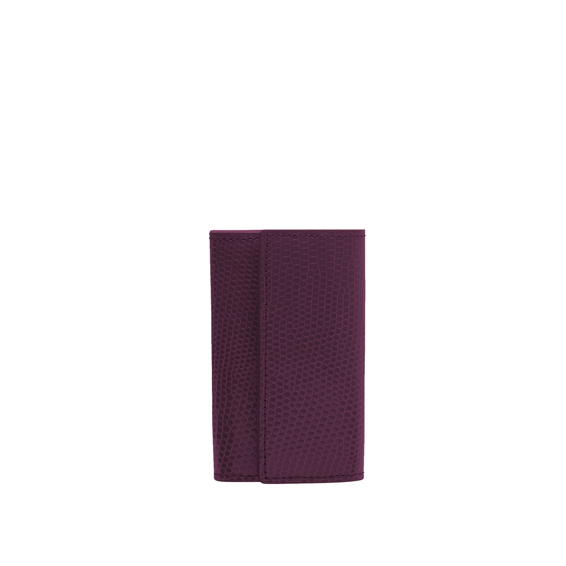 Small keyholder in Plump shiny lizard leather. Six internal key holders and one open compartment inside. Flap closure with clip.