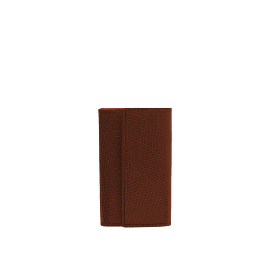 Small keyholder in black shiny lizard leather. Six internal key holders and one open compartment inside. Flap closure with clip.